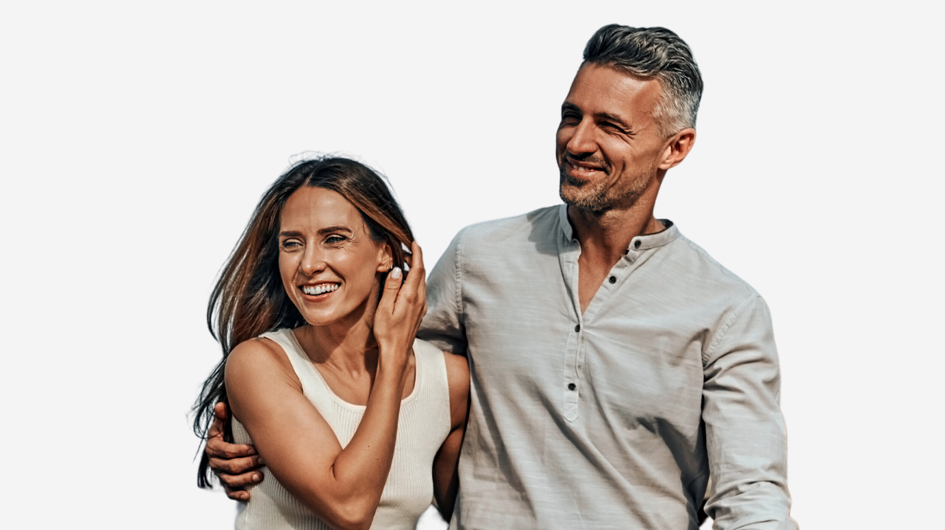 middle aged couple with beautiful smiles walk arm in arm