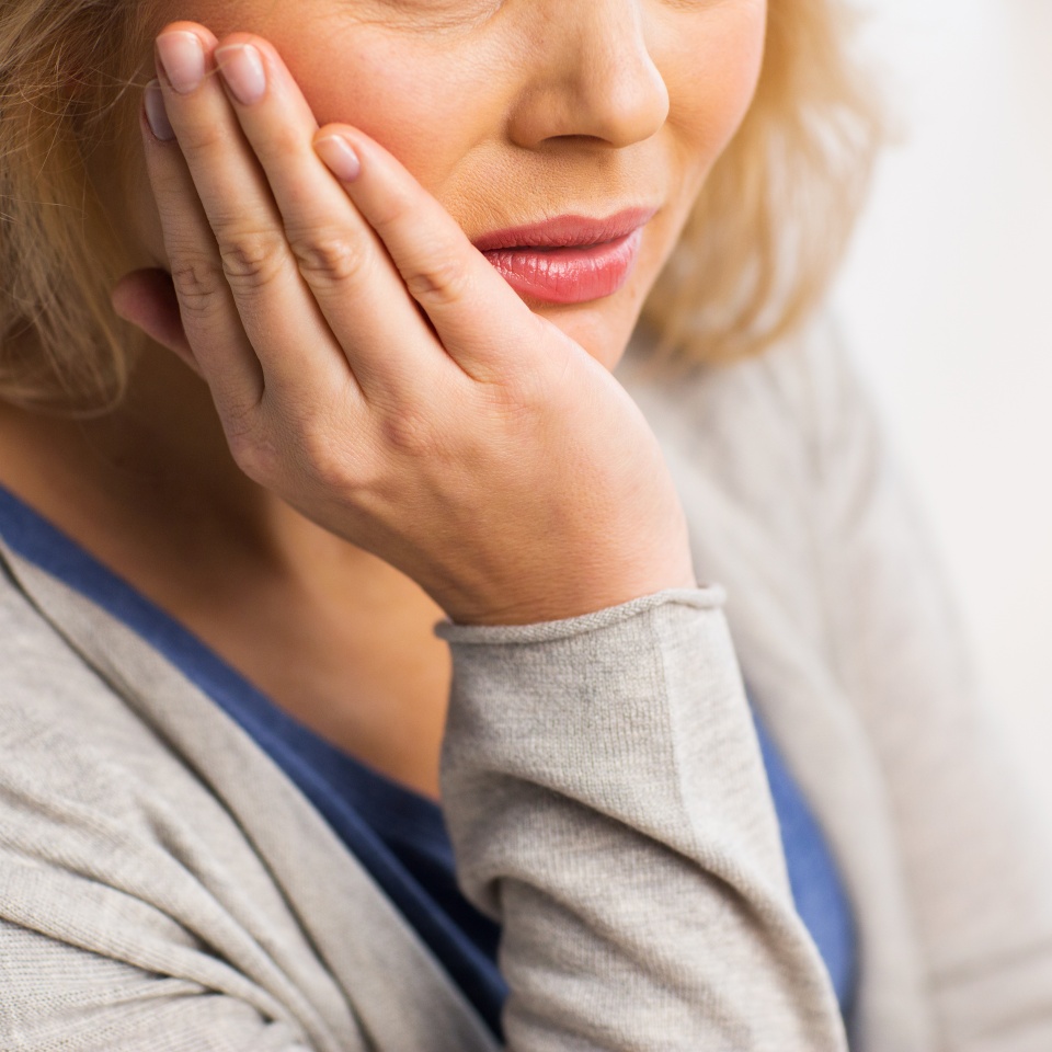 people, healthcare, dentistry and problem concept - close up of unhappy woman suffering toothache at home