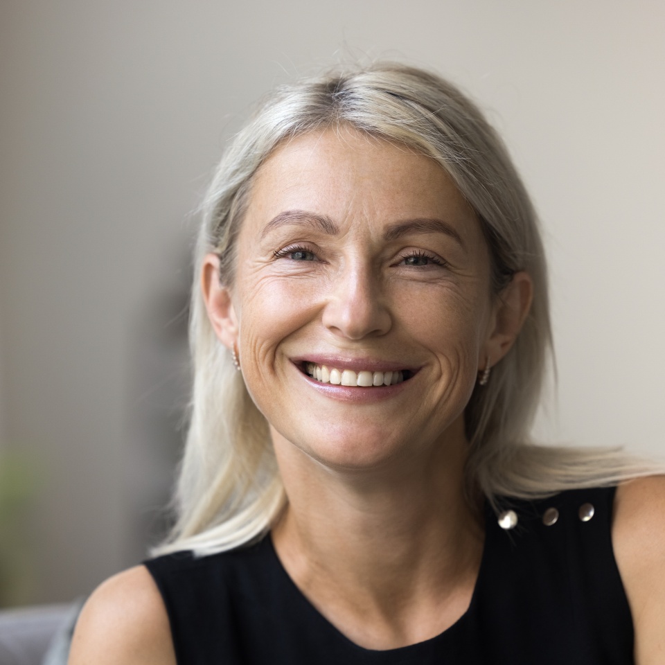 Head shot portrait 60 years old smiling grey haired lady on retirement looking at camera making video call enjoying happy life. Profile picture of beautiful stylish middle aged woman in social network